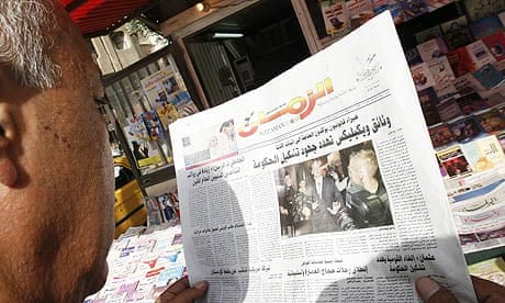 An Iraqi man reads newspaper with news on the Wikileaks documents in Baghdad.