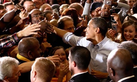 U.S. President Barack Obama shakes hands at a campaign rally in Minneapolis