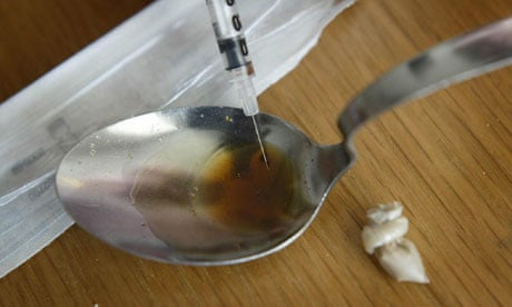 Heroin user prepares to take drug