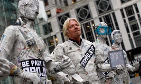 Virgin Group head Richard Branson stands outside New York City's flagship Apple store