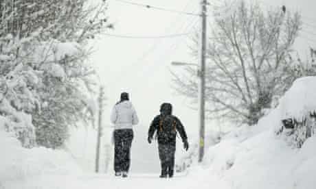 People walking in snow in Scotland