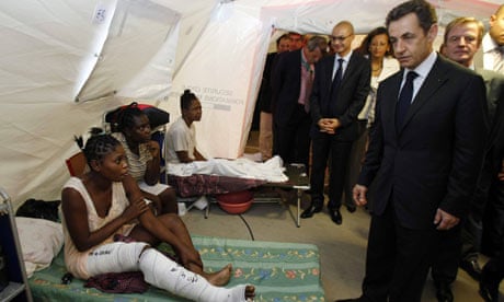 President Sarkozy speaks to an earthquake survivor in Haiti