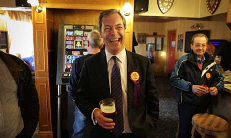 Ukip leader Nigel Farage shares a joke in the pub with party workers after campaigning in Winslow.