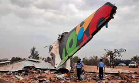 Rescue teams search the site of the Afriqiyah Airways plane crash in Tripoli, Libya