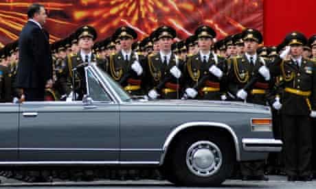 Russian defence minister Anatoly Serdyukov in his open ZiL limousine at a Red Square military parade