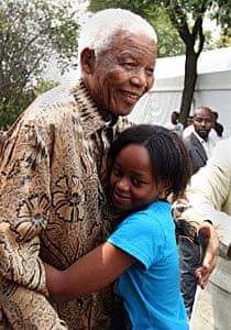 Nelson Mandela hugs his great-granddaughter Zenani, in 2008.