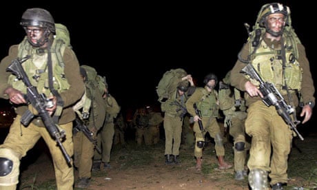 Israeli soldiers marching into the Gaza Strip
