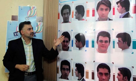 An official describes appropriate hairstyles for men at an official hairstyle show in Tehran