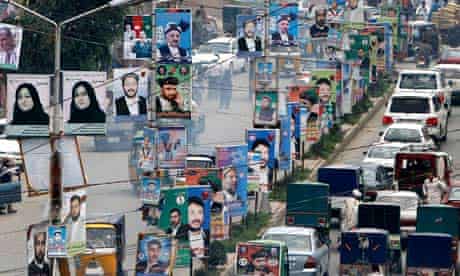 Election posters line a street in Jalalabad