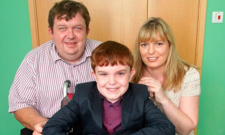 Ciaran Finn-Lynch, whose windpipe was rebuilt with his own stem cells, with parents Colleen and Paul