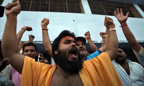 A Hindu priest celebrates after Ayodhya verdict