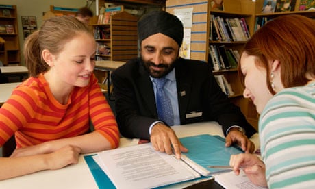 A Sikh teacher with sixth-form students