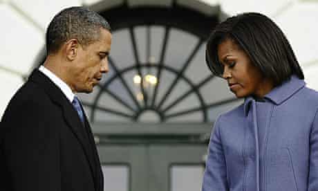 Barack and Michelle Obama observe a moment of silence with White House staff for the Tucson victims