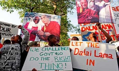 Supporters of the Dalai Lama protest outside parliament in Cape Town.