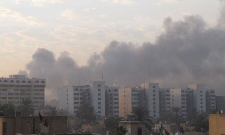 Smoke rises from the site of a bomb attack in central Baghdad