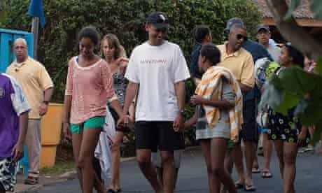 Barack Obama with his daughters, Malia and Sasha, at the Sea Life Park in Honolulu last week.