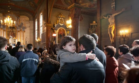 Marcin Baniak and his daughter Amelia at mass