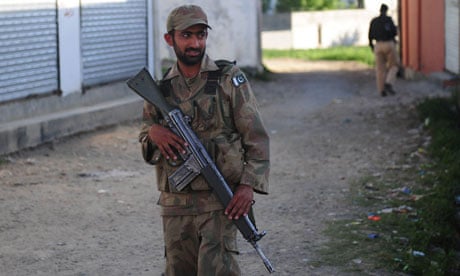 Pakistani soldier outside Bin Laden compound