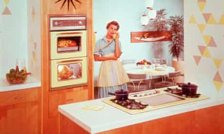 Housewife in the kitchen talking on the phine, very fifties