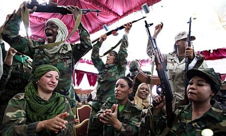 Female Libyan supporters of Gaddai celebrate after graduation in weapons training