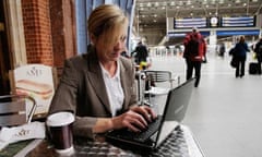 A businesswoman uses a netbook