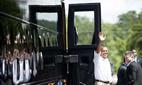 Barack Obama waves before boarding his bus outside  in Cannon Falls, Minnesota.