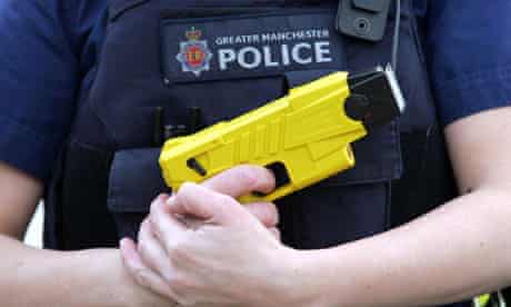 Greater Manchester police officer holding a Taser