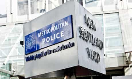 Metropolitan Police sign outside New Scotland Yard, London