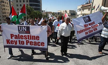 Palestinians rally outside the United Nations building in the West Bank city of Ramallah.