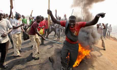 Demonstrators protest the elimination of a popular fuel subsidy near Nigeria's capital Abuja