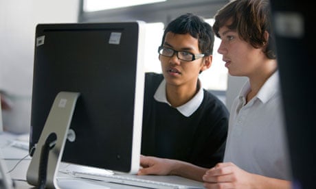 Teenage boys using school computer
