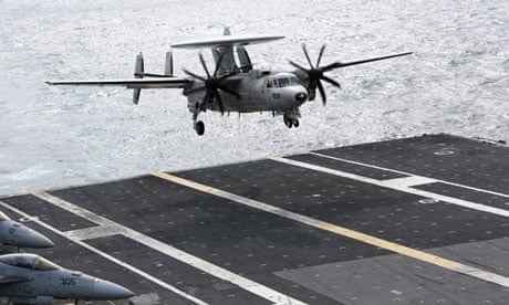 An E-2C Hawkeye aircraft lands on the USS George Washington in the South China Sea on 20 October