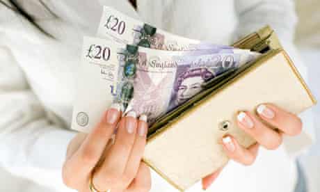 Woman with £20 notes in purse
