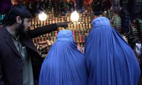 Women in Afghanistan shop at a market ahead of Eid al-Adha