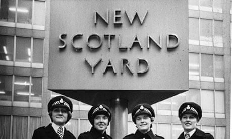 Female Met officers pose in front of New Scotland Yard in 1977.