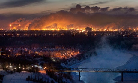 Steam rises from oil refineries over Edmonton in Alberta