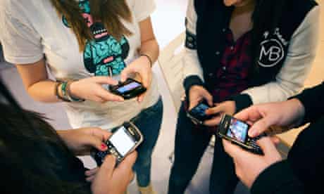 Pupils using mobiles