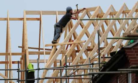 A roofer at work on houses being built in Derbyshire
