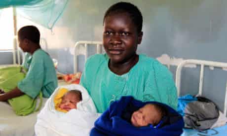 Millicent Owuor, 20, with her newly born twin boys Barack and Mitt