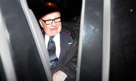 Media mogul Rupert Murdoch leaves his Fifth Avenue home in New York