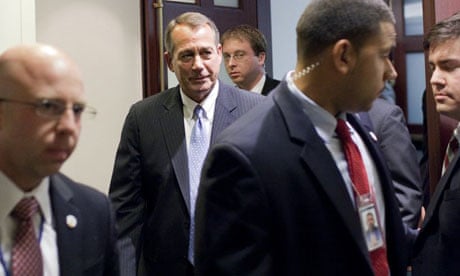 John Boehner leaves a meeting with House Republicans