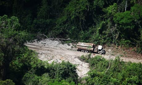 A logging truck enters a deforested area on the outskirts of Novo Progresso, Brazil
