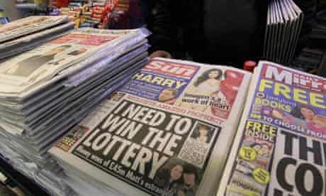 The Sun on sale in London on Saturday as police arrested five senior journalists