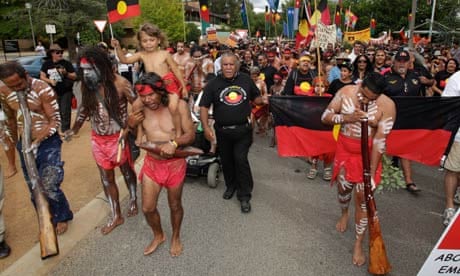 Indigenous and other protesters interrupt an Australia Day awards ceremony in Canberra.