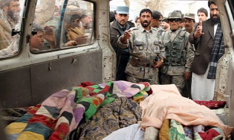 Afghan residents with bodies of shooting victims 