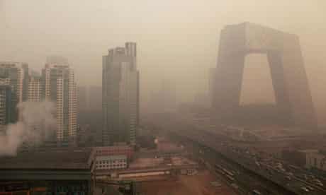 Heavy pollution surrounds the China Central TV building (right) in Beijing on 18 January, 2012