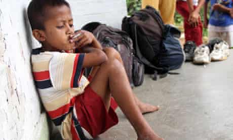 Eight-year-old boy smoking in Indonesia