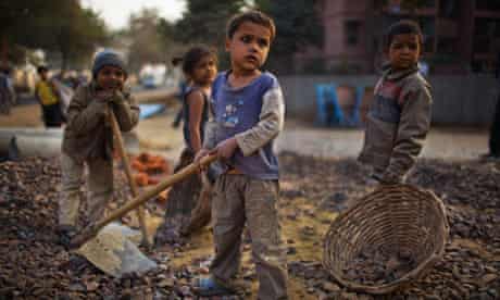 Indian children working parents at a construction site near the Jawaharlal Nehru Stadium, Delhi