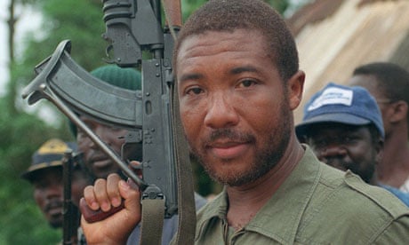 A 1990 photograph of Charles Taylor holding an AK-47 rifle as his rebels marched on Monrovia