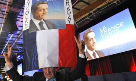 A Nicolas Sarkozy supporter flashes a V for victory sign at a rally on Saturday